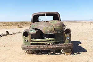 Metal Prints: A rusty abandoned car in the desert near Aus in southern Namibia, Africa