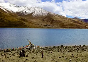 Tibet Prints: Sacred Tibetan Yamdrok Tso Lake (Yamzho Yumco) with mountains in background beside the Friendship Highway