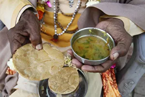 Human Hand Prints: Sadhu eating vegetarian food, Dauji, Uttar Pradesh, India, Asia