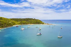 Antilles Prints: Sailboats and catamarans moored in a tropical bay, aerial view by drone, Caribbean Sea