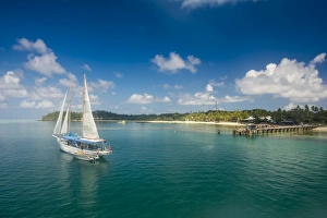Sailing boat anchoring on Mana Island, Mamanuca Islands, Fiji, South Pacific