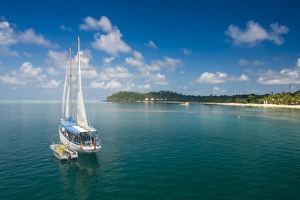 Sailing Boat Prints: Sailing boat anchoring on Mana Island, Mamanuca Islands, Fiji, South Pacific