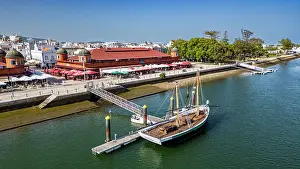 Trading Prints: Sailing boat docked near the historic market in Olhao