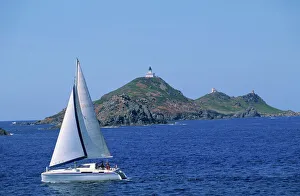 Light House Prints: Sailing boat with the Semaphore Lighthouse behind, Iles Sanguinaires, island of Corsica