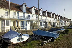 Kent Prints: Sailing boats and holiday homes on the seafront, Whitstable, Kent, England