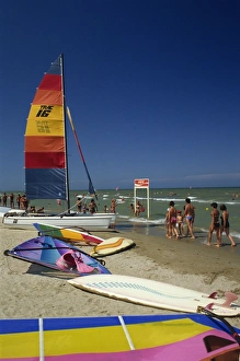 Rimini Prints: Sailing boats and windsurfing boards on beach at Rimini