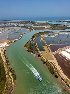 Economy Prints: Saltpans of Tavira show water channels and salt harvest boats in Algarve