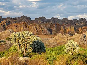 Wonders Prints: Sandstone formations rise above greenery in Isalo Massif near Relais de la Reine Hotel in Madagascar
