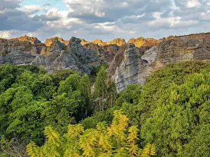 Madagascar Prints: Sandstone formations rise among trees in Isalo Massif