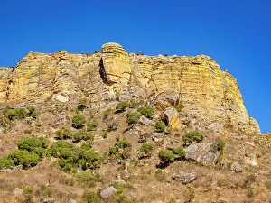 Madagascar Prints: Sandstone formations soar high at Isalo Massif in Madagascar with clear blue skies above