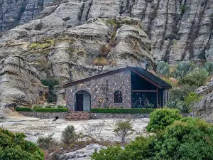 Madagascar Prints: Sandstone formations surround a stone structure at Relais de la Reine Hotel in Isalo Massif region