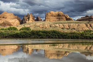 Stormy Sky Prints: Sandstone rocks reflecting in the Colorado River