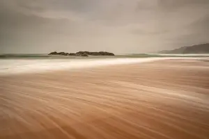 Sandwood Bay in early morning with Cape Wrath in far distance, Sutherland, Scotland