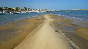 Birds Prints: Sandy wetlands surround waterways near Olhao