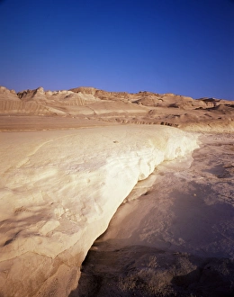 Inhospitable Prints: Sarakiniko volcanic rock formations at sunset