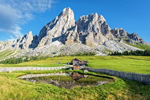 Dolomites Gallery: Sass de Putia and the reflection of a mountain hut in a small pond, Passo delle Erbe, Dolomites