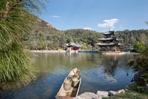 Lijiang Prints: Scene at Black Dragon Pool (Heilongtan) with boat carrying wicker baskets and Moon Embracing Pavilion
