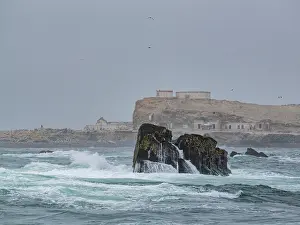 Saltwater Prints: Scenes capture rough waters and rocks in Palomino Islands on a foggy stormy day near Lima Peru