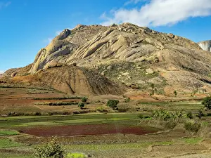 Ecology Prints: Scenes of rocky hills and farmland along the highway near Anja Community Reserve in Madagascar during clear weather
