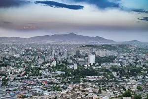 Kabul Prints: Scenic overlook shows the city of Kabul and surrounding mountains at dusk