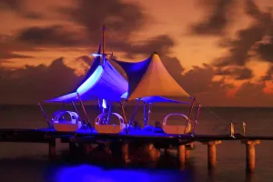 Event Prints: Scenic sunset lighting up the Coco de Mer hotel dock in Praslin