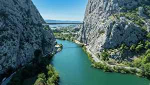 Canyon Prints: Scenic view of the Cetina gorge and river revealing rocky cliffs and turquoise waters in Croatia during a sunny day