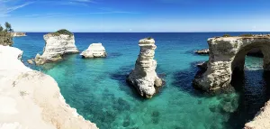 Vista Prints: Scenic view of the faraglioni di Sant Andrea in Salento Italy during a bright sunny day along the coastline