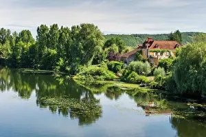 Ride Prints: Scenic view of Lot River with reflections in the water near Juillac in southwest France