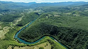 Flowing Prints: Scenic view of the Una river winding through Una National Park in Bosnia and Herzegovina
