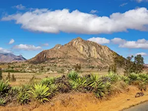Bright Prints: Scenic views along the highway near Anja Community Reserve in Madagascar feature hills and vegetation