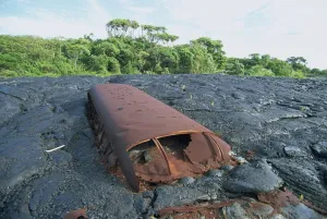 Big Island Prints: School bus near Kaimu buried in the 1988 basalt lava flows that covered a large area of the southeast Puna coast