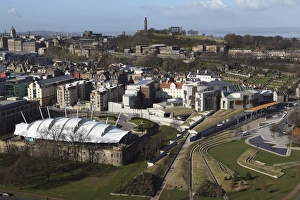 Aerials Prints: The Scottish Parliament stands in the foreground, under Calton Hill, in Edinburgh