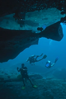 Under Water Prints: Scuba divers in underwater cave, Southern Thailand, Andaman Sea, Indian Ocean, Asia
