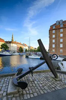 Sailing Boat Prints: Sculpture of an anchor on the banks of Christianshavn Canal with Church of Our Saviour