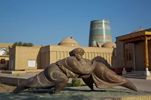 Search Results: Sculpture with Kalta Minaret in the background, Ichon Qala (Itchan Kala)