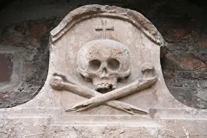 Frauenkirche Prints: Sculpture of skull and crossed bones outside Frauenkirche, Munich, Bavaria, Europe