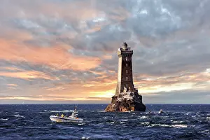 Fishermen Prints: Sea bass fishing boat beside the lighthouse of La Vieille
