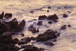 Sea breaking against rocks on the coast at Coverack, Cornwall, England