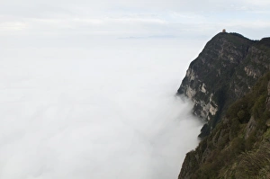 Sea of clouds and Golden Summit temple at Mount Emei Shan, Mount Emei Scenic Area Sea of clouds and Golden Summit temple at Mount Emei Shan, Mount Emei Scenic Area