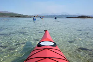 Sea kayaking near Arisaig, Highlands, Scotland, United Kingdom, Europe