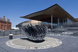 Images Dated 30th May 2009: Seafarers War Memorial on the hull of a beached ship in front of the Senedd