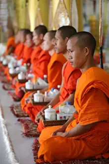 Ceremony Prints: Seated Buddhist monks chanting and reading prayers at a ceremony