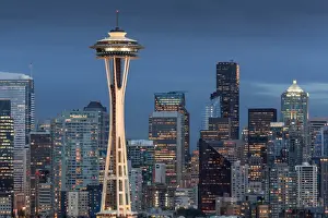 Office Buildings Prints: Seattle city skyline at night with illuminated office buildings and Space Needle
