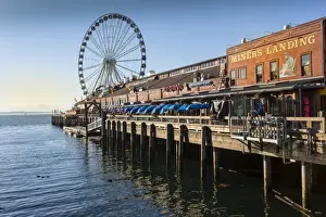 Ferris Wheel Prints: Seattle Great Wheel on Pier 57 in the foreground in late afternoon sunshine. Seattle
