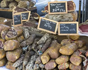 Corsica Prints: Selection of Corsican sausages and hams for sale at open-air market in Place Foch