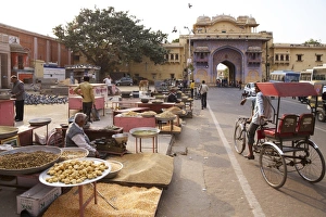 Selling Prints: Sellers of pigeon food outside gates of City Palace, Jaipur, Rajasthan, India, Asia