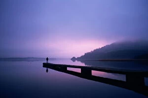 Jetty Gallery: Setting sun through rising mist, Bassenthwaite Lake, Lake District, Cumbria