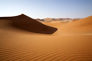 Shadow and light among the sand dunes shaped by wind, Deadvlei, Sossusvlei, Namib Desert