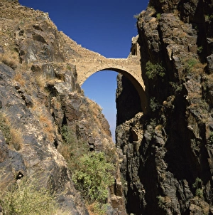 Rock Cliff Prints: The Shahara Bridge over a rocky gorge