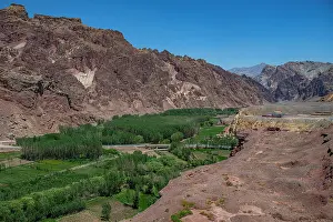 Irrigation Prints: Shahr-e Zuhak shows rocky landscape with greenery along river in Afghanistan